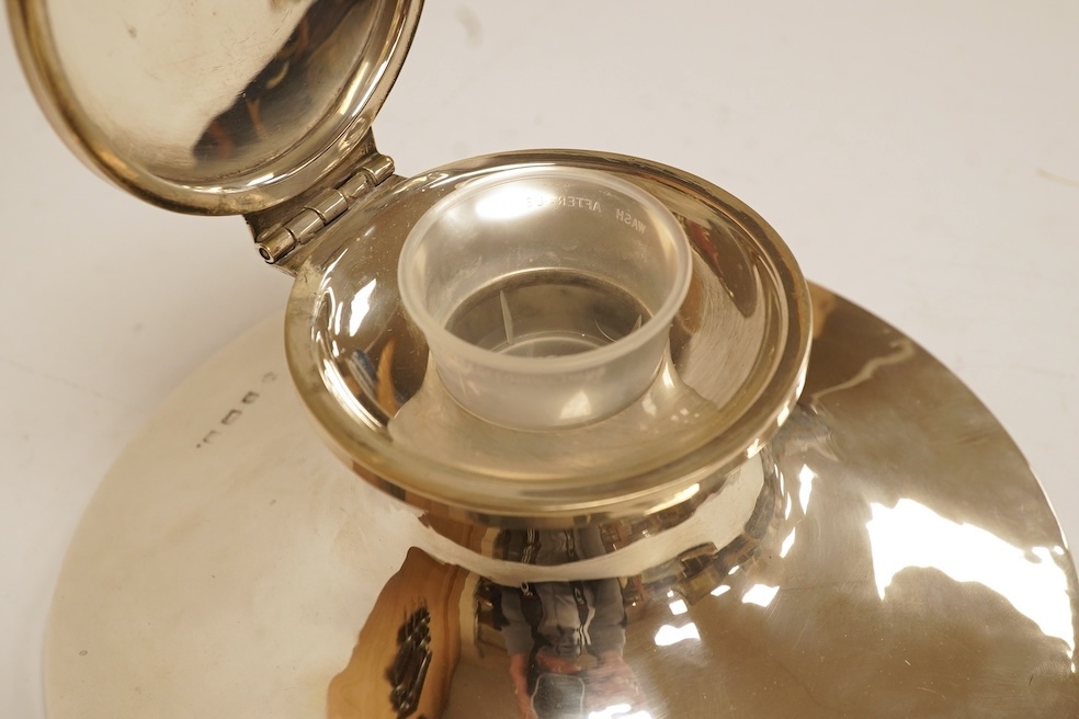 A George V silver mounted capstan inkwell, maker's mark rubbed, Birmingham, 1911, with later plastic well, base diameter 17.7cm. Condition - fair